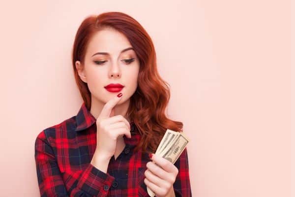 woman thinking about money with financial questions