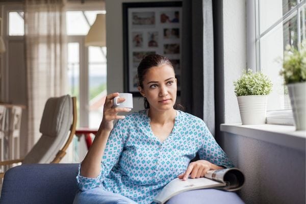 woman looking out the window