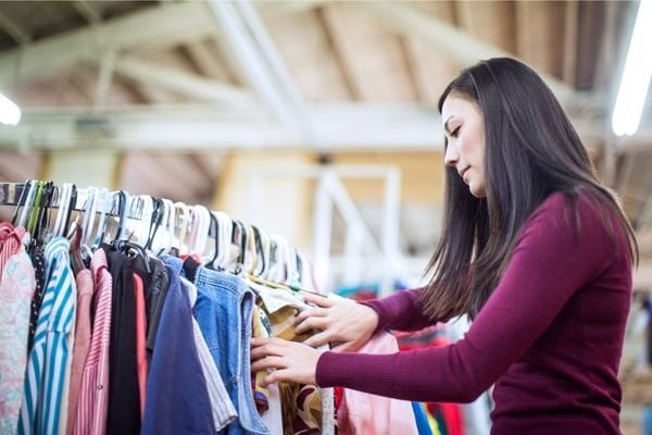 woman shopping at thrift store