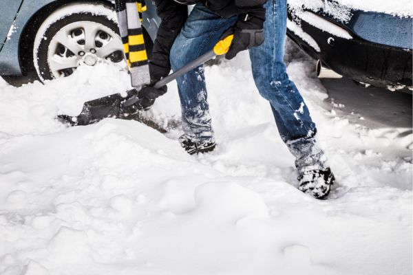 teenager shoveling snow