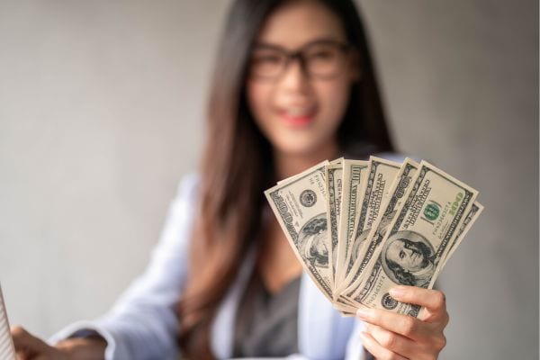 woman holding cash