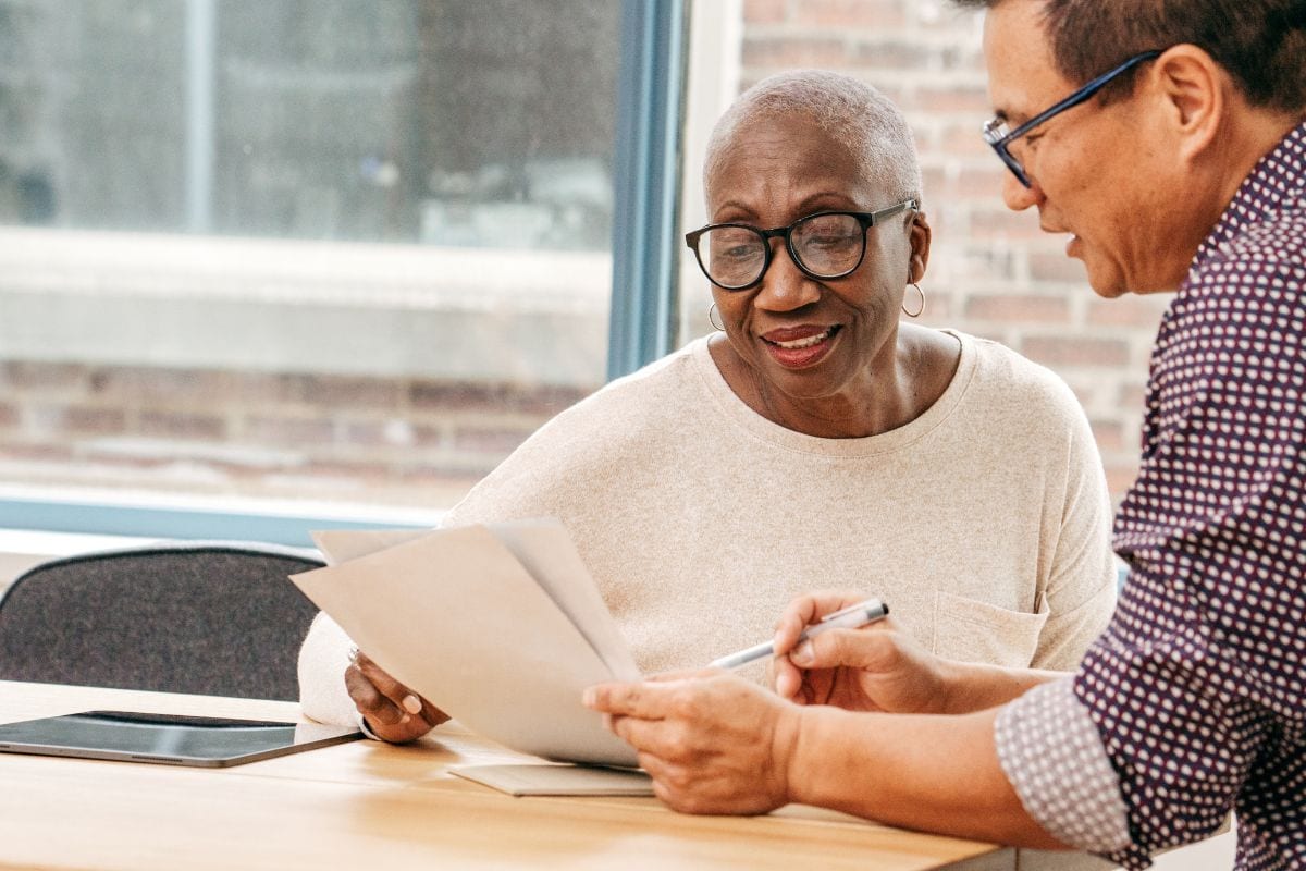 older woman looking at paperwork