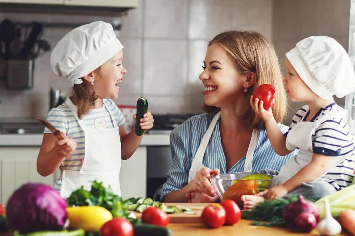 mother and kids cooking in the kitchen