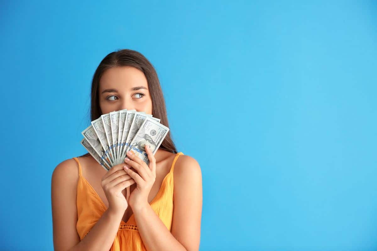 No spend month challenge featured image woman with cash