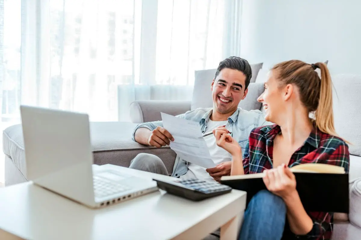 couple laughing because they have.a rich person mentality