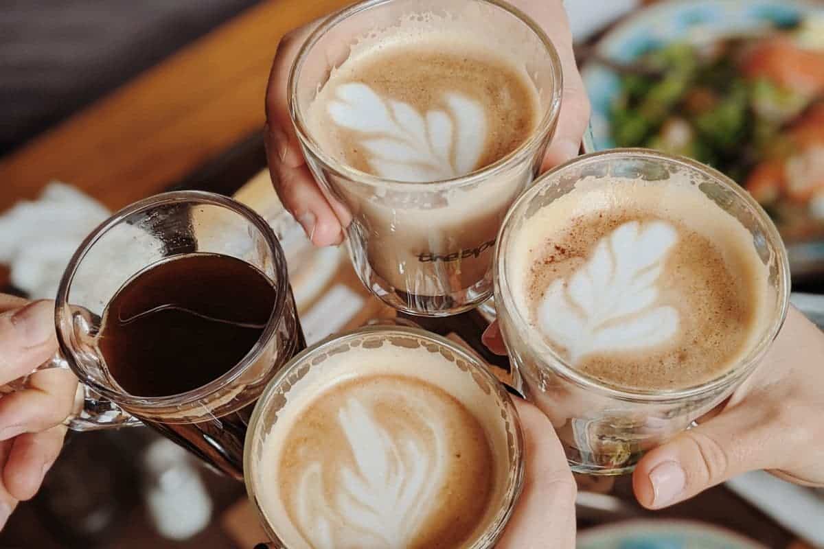 coffee challenge, fancy lattes held by hands