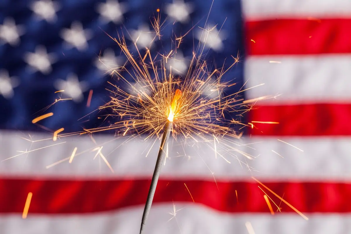cheap or free 4th of july activities and things to do featured image of flag and sparkler