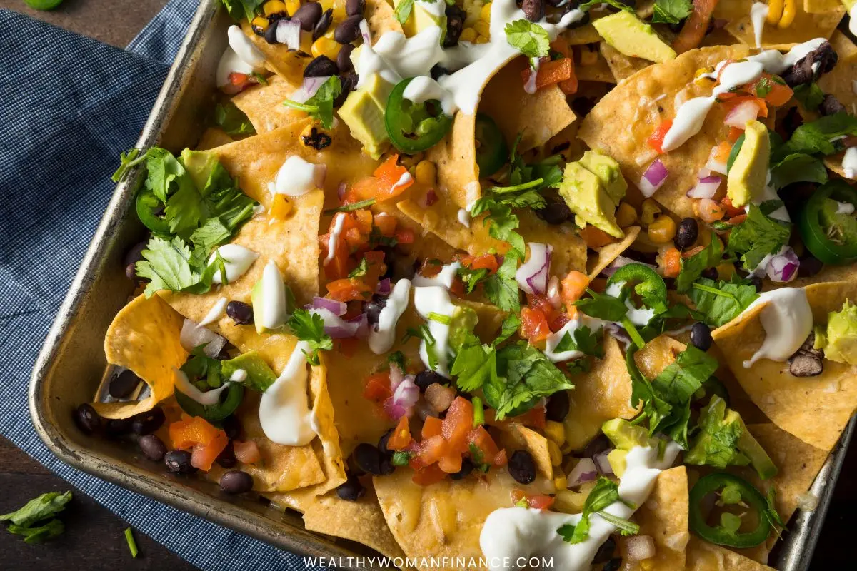 sheet pan nachos are a fun and affordable way to feed a crowd on a budget