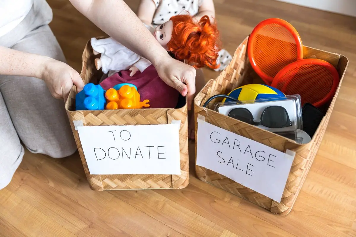 cleaning out kids stuff, donate and garage sale boxes