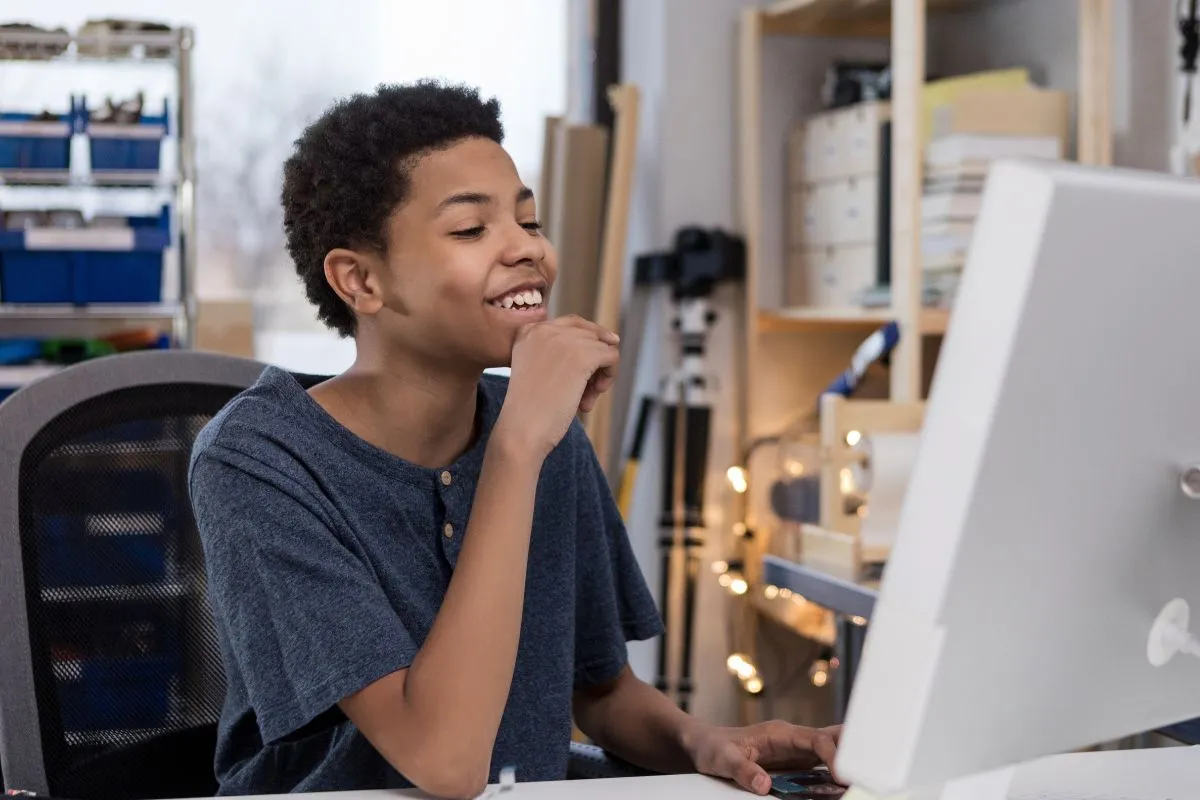 teenager boy on computer