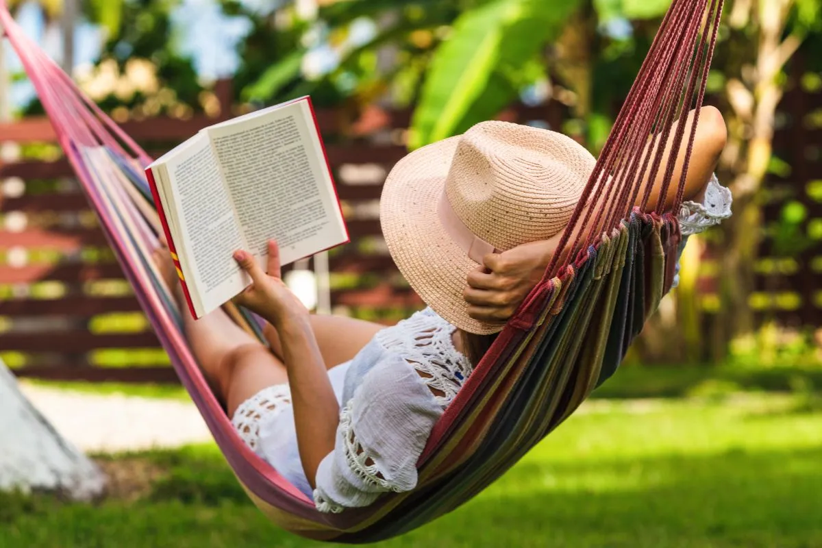woman in hammock reading a book