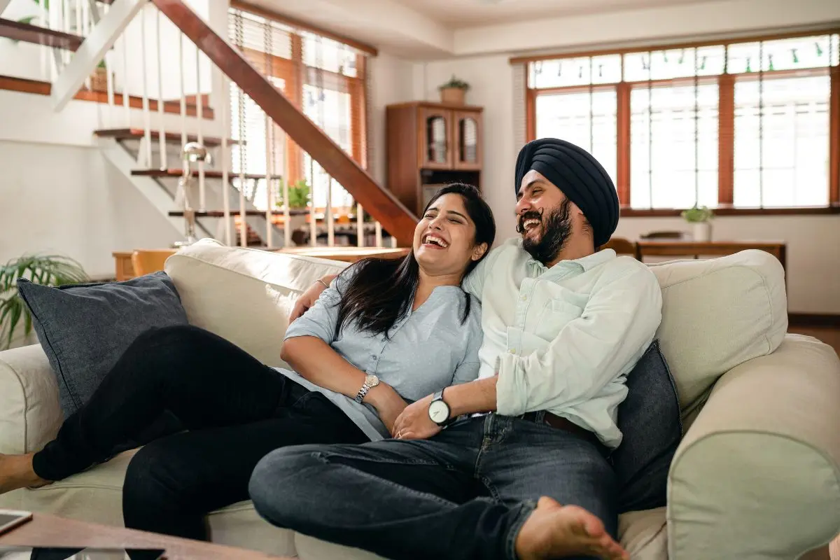 couple laughing on the couch