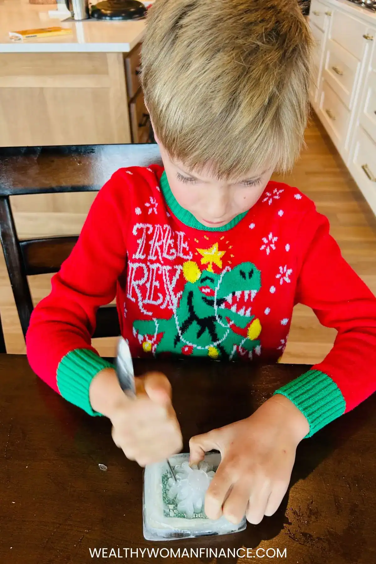 boy trying to free money from ice in game